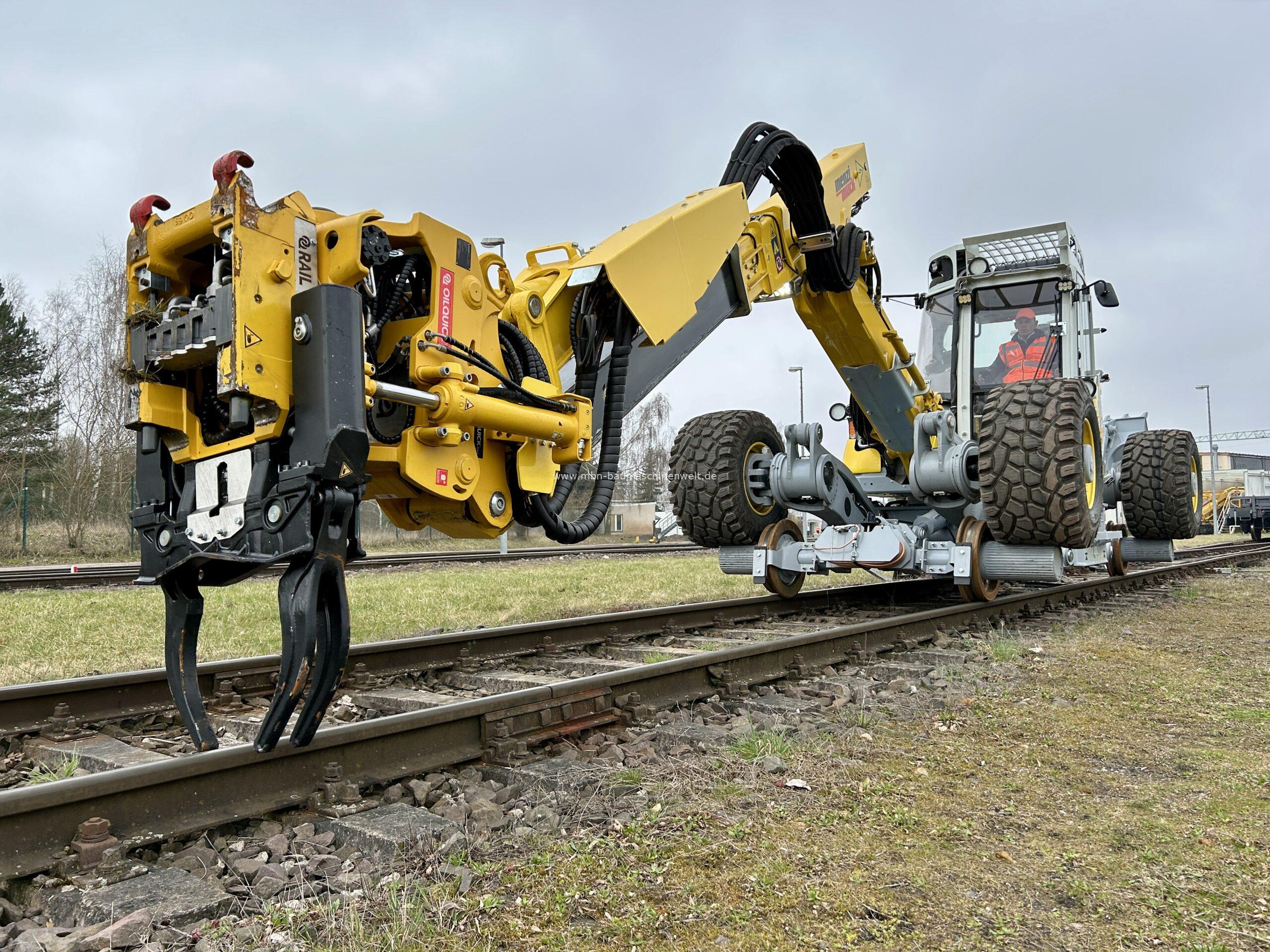 Menzi Muck M545x Rail mit Oilquick OQ65 Menzi Muck M545x